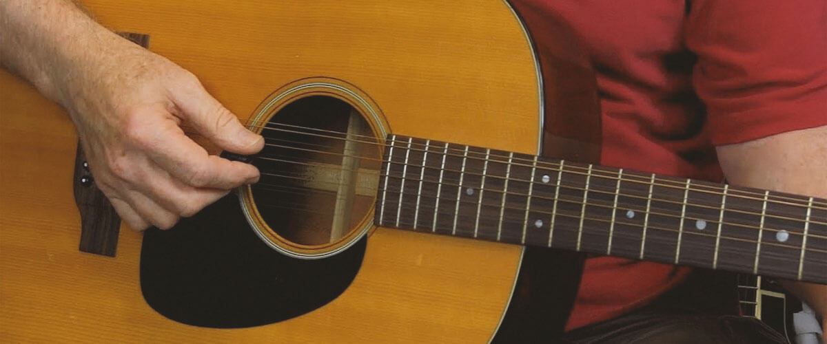 playing on a 12 string guitar